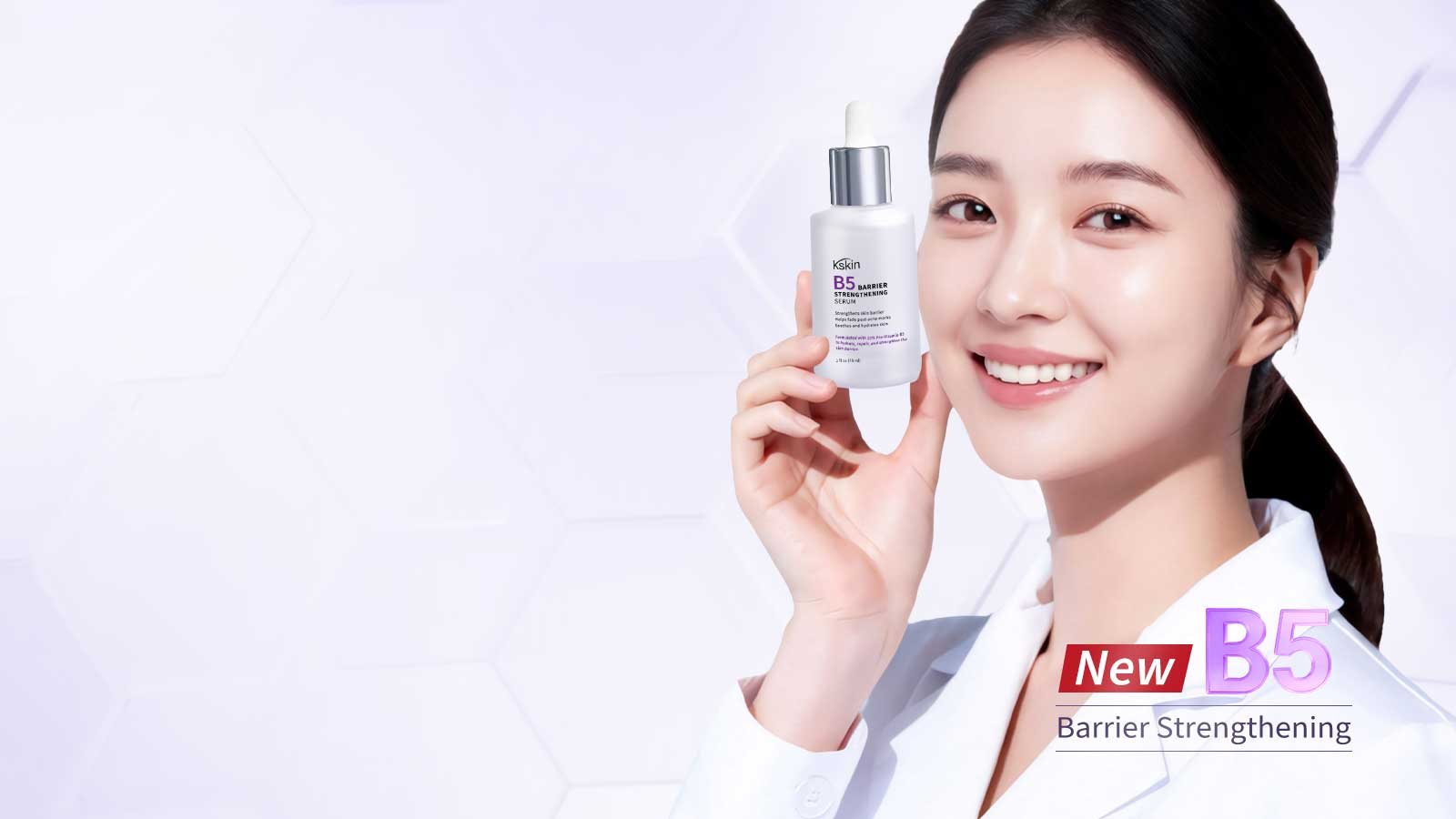 Woman holding the Kskin B5 Barrier Strengthening Serum